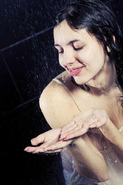girl taking a shower - 写真・画像