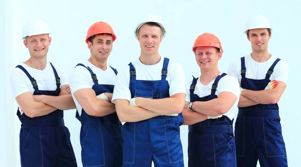 team of professional builders in helmets - Foto, imagen