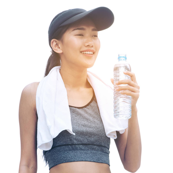 水のボトルを保持しているスポーツ女性の分離イメージ - 写真・画像