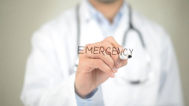 Emergency, Doctor writing on transparent screen - Photo, Image