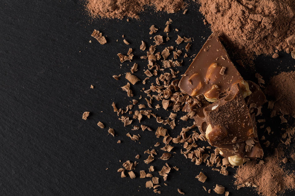 Broken chocolate nuts pieces  - Фото, изображение
