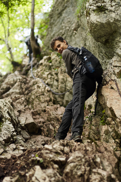 Teenage boy hiking on forest trail  - Foto, Bild