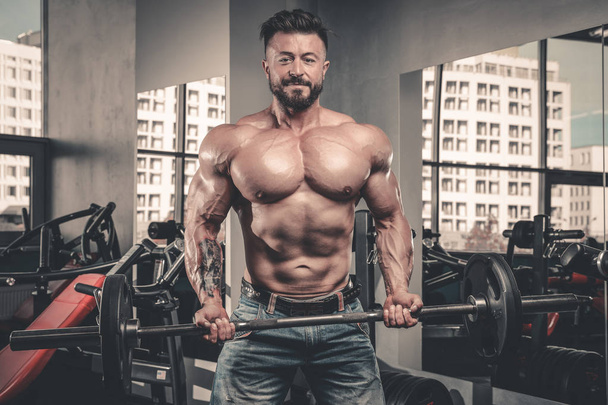 Handsome power athletic man on diet training pumping up muscles - Φωτογραφία, εικόνα
