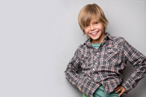 adorable young happy boy wearing shirt  - Foto, afbeelding