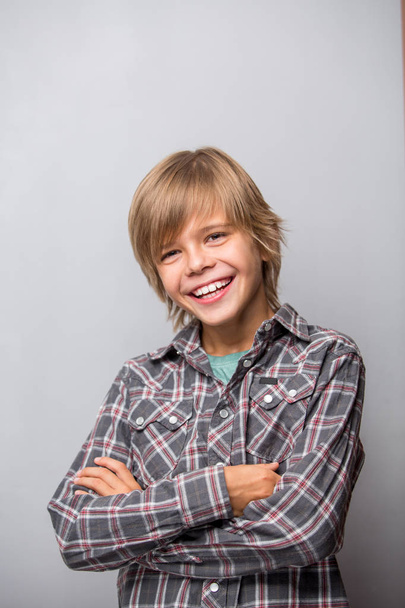 adorable young happy boy wearing shirt  - Фото, зображення