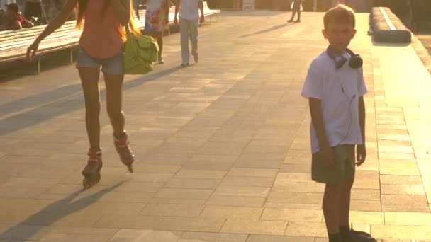 Skateboarding in the city park at sunset - Filmati, video