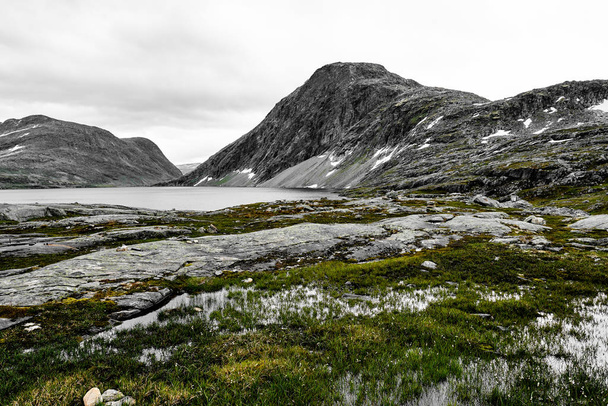 Landscape and snow covered mountains in western Norway with a lake - Photo, Image