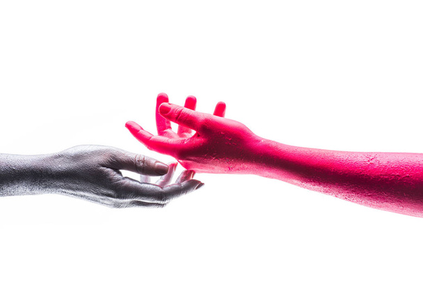 Support, hands on white background isolated, silver and red human hand. Gentle touch, trust. Art project, creative self expression. Different colors and different races. Paints and color science - Фото, изображение