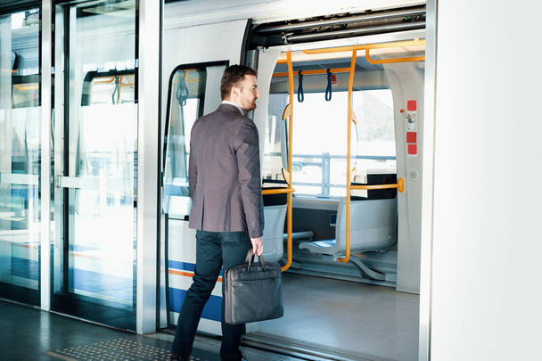 Businessman commuter traveling on the metro underground - Zdjęcie, obraz