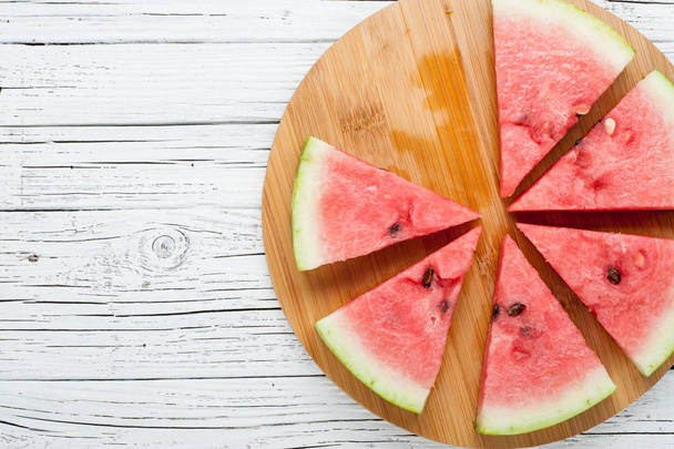 watermelon slices on white wooden background top view - Zdjęcie, obraz