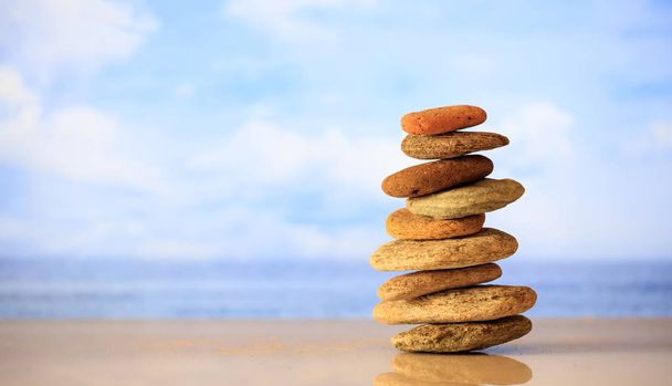 Zen stones stack on blue sky and sea background - Photo, Image