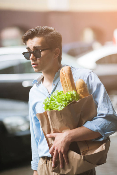Stylish male pedestrian shopping. Healthy food - Φωτογραφία, εικόνα