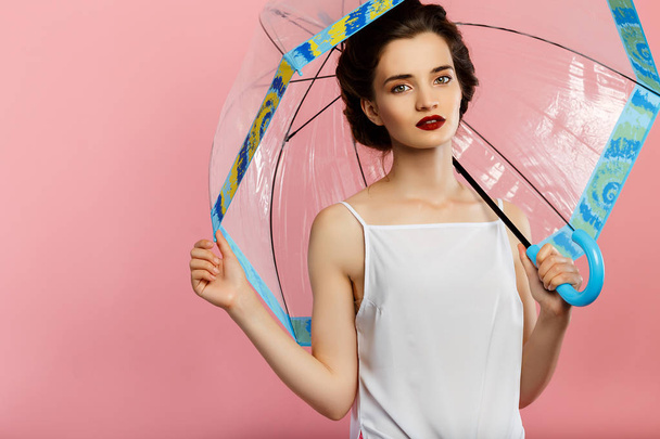 young cute woman with retro hair and umbrella - Foto, immagini