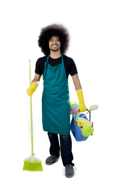 Afro maid holds a broom and bucket - Foto, Imagen