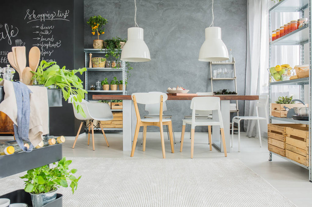 Industrial dining room with table - Foto, afbeelding