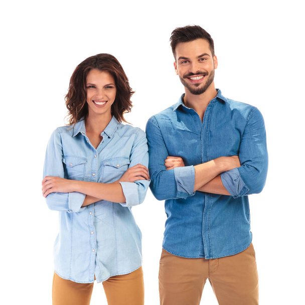 confident casual man and woman with hands crossed laughing  - Foto, Imagen