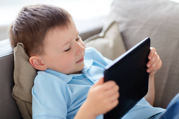 little boy with tablet pc computer at home - Foto, Bild