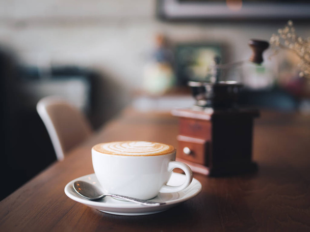 cup of coffee latte art on the wood desk coffee shop cafe - Φωτογραφία, εικόνα