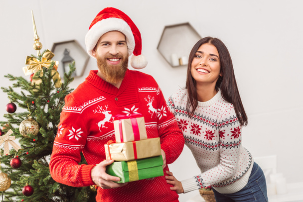 young couple with christmas presents - Photo, Image