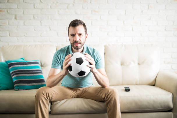 man holding soccer football ball  - Valokuva, kuva