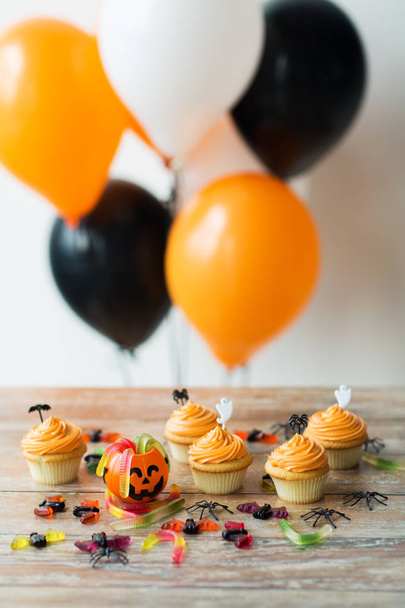 halloween party decorated cupcakes on wooden table - Photo, Image