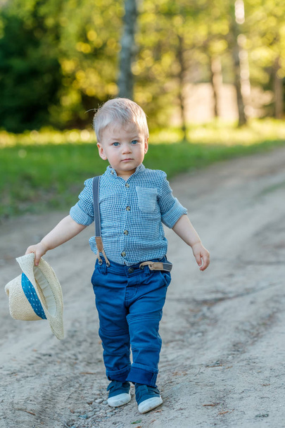 Baby boy wearing straw hat - Zdjęcie, obraz