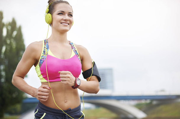  woman jogging in headphones - Photo, Image