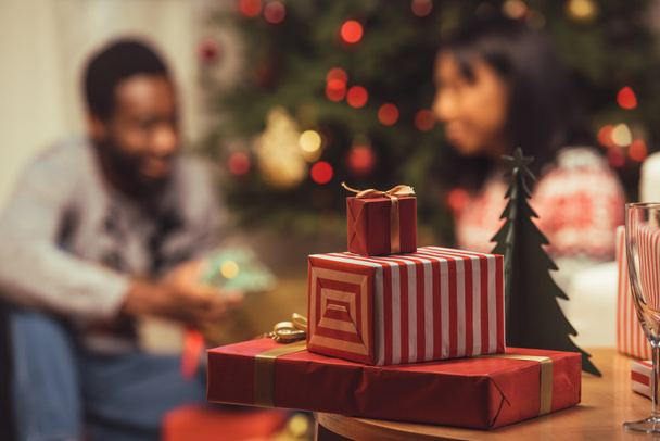christmas gifts on table - Фото, изображение