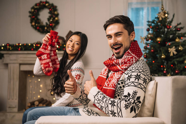 multicultural couple celebrating christmas together - Valokuva, kuva