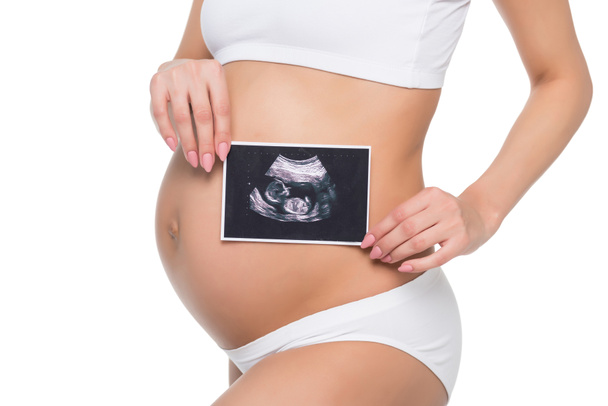 Ultrason taraması olan hamile bir kadın. - Fotoğraf, Görsel