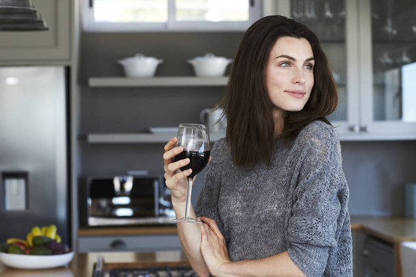 Beautiful brunette woman drinking wine - Fotoğraf, Görsel