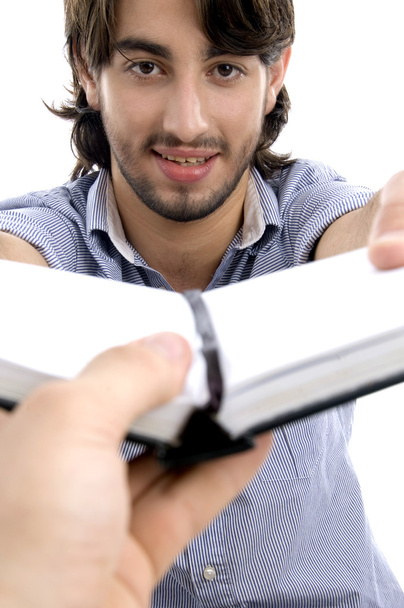 Handsome man showing his diary - Photo, image