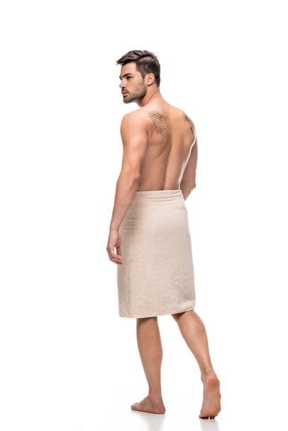 man covering with towel after shower - Zdjęcie, obraz