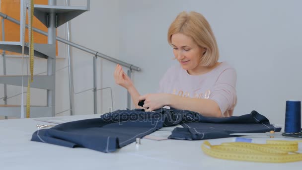 Professional tailor, fashion designer working at sewing studio - Footage, Video