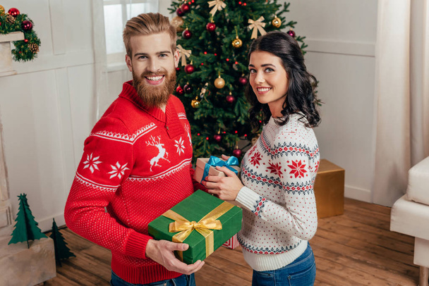 couple with christmas gifts - Фото, изображение