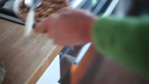 Woman putting fruit dessert in oven - Кадри, відео