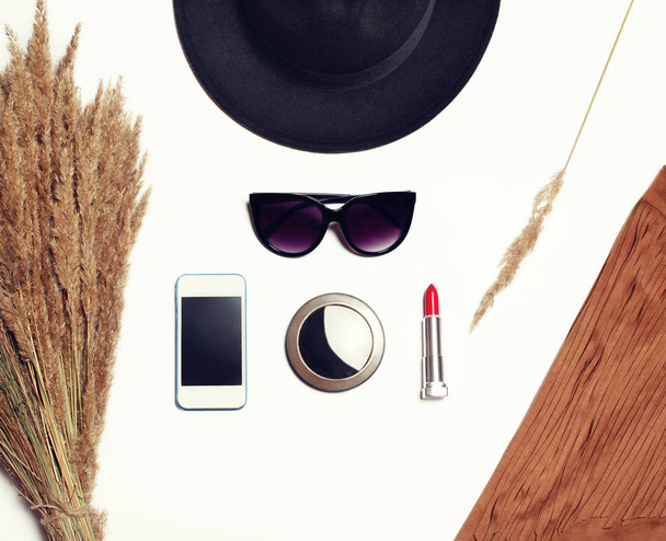 Fashion accessory, black hat, sunglasses, screen smartphone, poc - Foto, Imagen