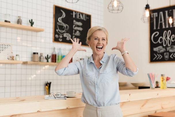 excited businesswoman in cafe - Photo, Image