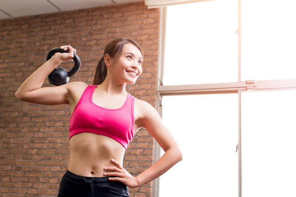  woman with kettlebell in the gym - Photo, image