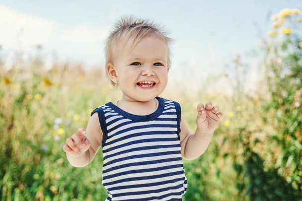 Funny little boy one year old, joyful summer portrait - Photo, Image