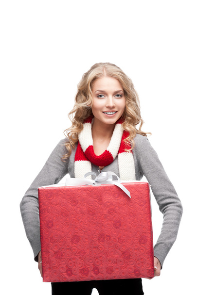 Young smiling woman holding christmas gift - Foto, Bild