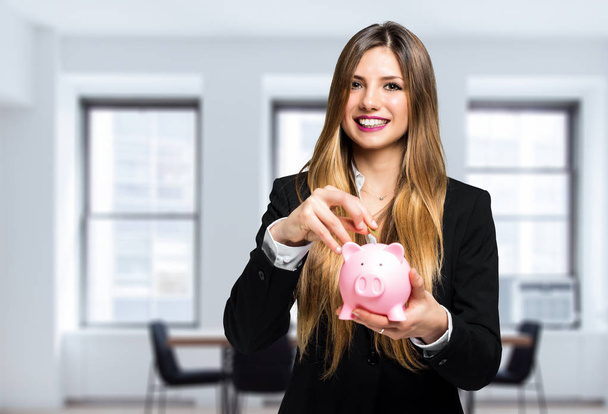 beautiful businesswoman holding piggy bank  - Φωτογραφία, εικόνα