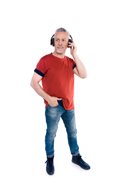 Senior man in big headphones  - Fotoğraf, Görsel