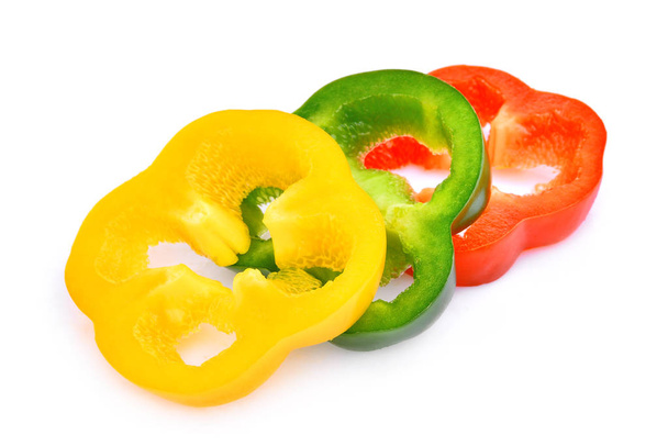 slice of sweet bell pepper or capsicum isolated on white backgro - Zdjęcie, obraz