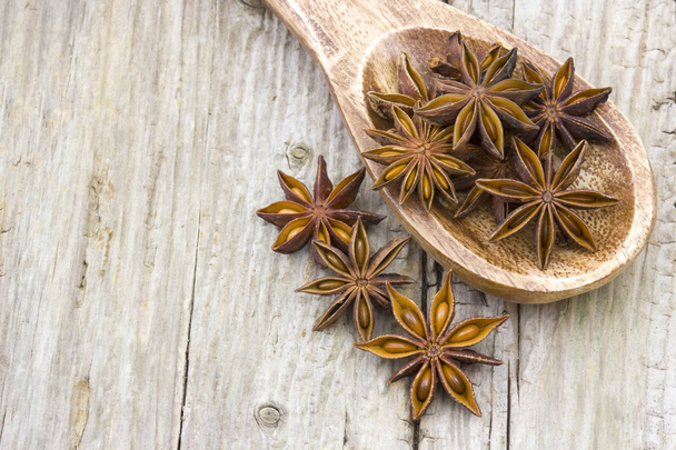 star anise on wooden spoon - Photo, Image