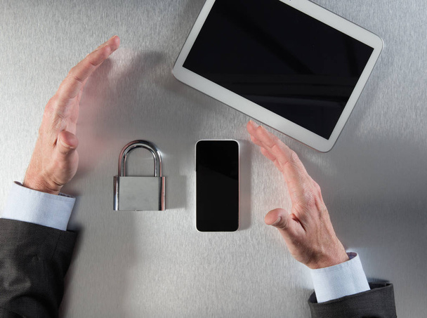 confident businessman hands showing corporate data security and safety - Фото, зображення