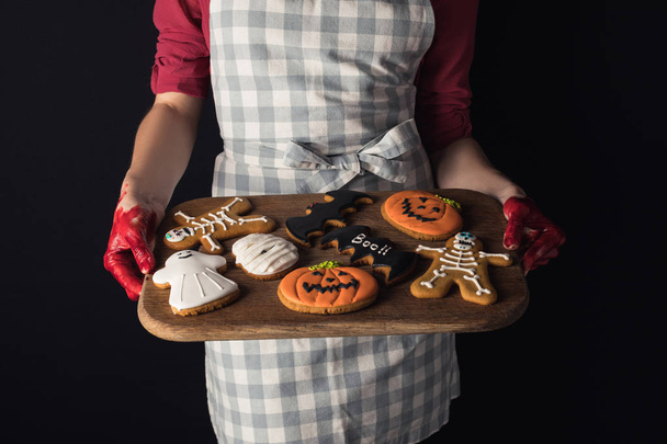 girl holding tray with halloween cookies - Photo, Image