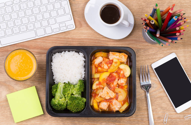 Lunch box with healthy diet meal on desk at workplace, top view  - Foto, Imagem