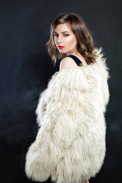 Cute Woman Fashion Model in Autumn or Winter Fur Coat.  - 写真・画像