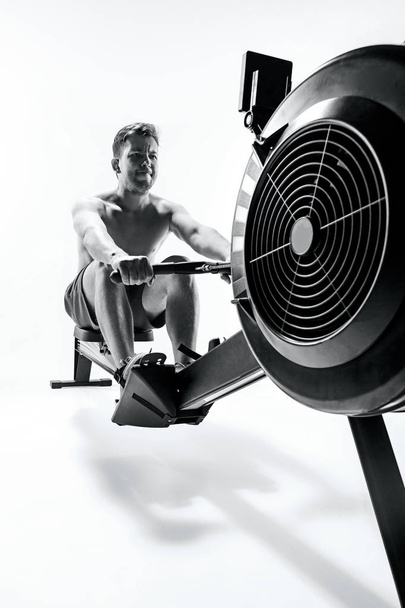 Man Using A Press Machine In A Fitness Club. - Zdjęcie, obraz